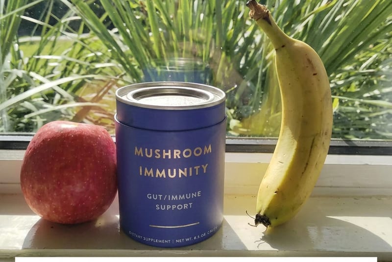 Peter Orpen holding Teelixir mushroom supplements – Australian-owned brand